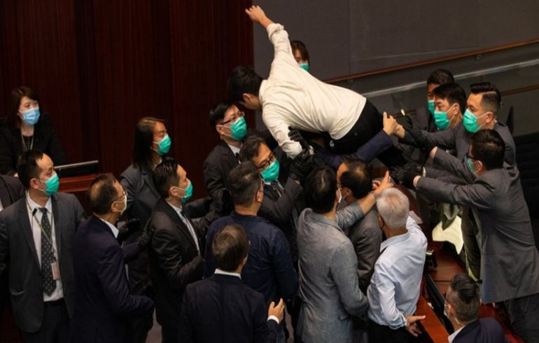 Hong Kong: Lawmakers Carried Out During Parliament Mayhem