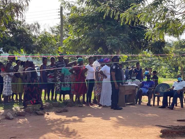 Residents Queue for MP's Fee-Paying, Clothing, and Shoes