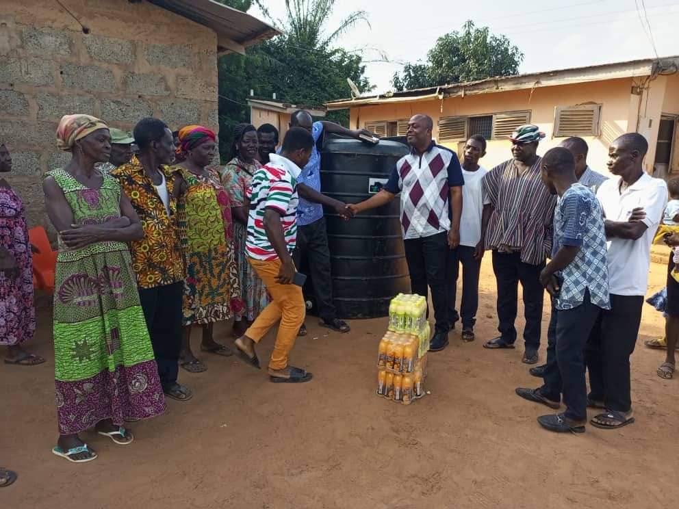 Asuogyaman MP Visits Remote Villages with 40 Horsepower Outboard Motor and Polytanks